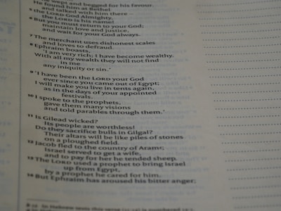 A close-up view of a page from a book with text in a serif font. The text appears to be in English and contains numbered paragraphs with religious or historical content. There are dotted lines on the right side of the page, possibly indicating space for notes.