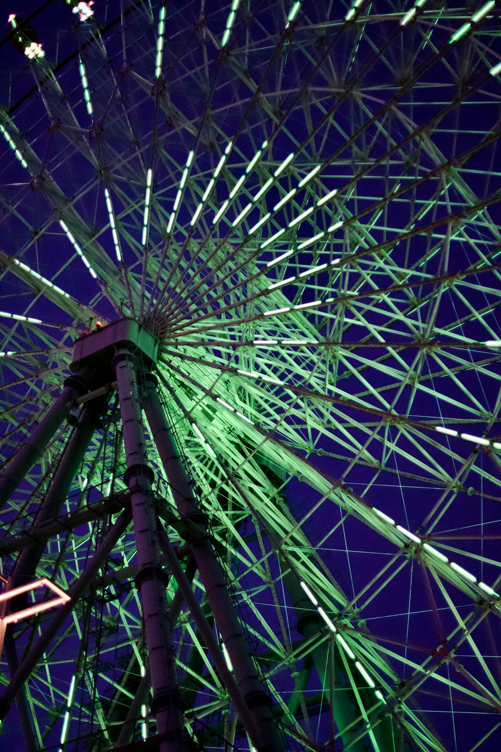 a large ferris wheel lit up at night