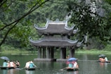 a group of people on small boats in the water