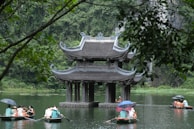 a group of people on small boats in the water