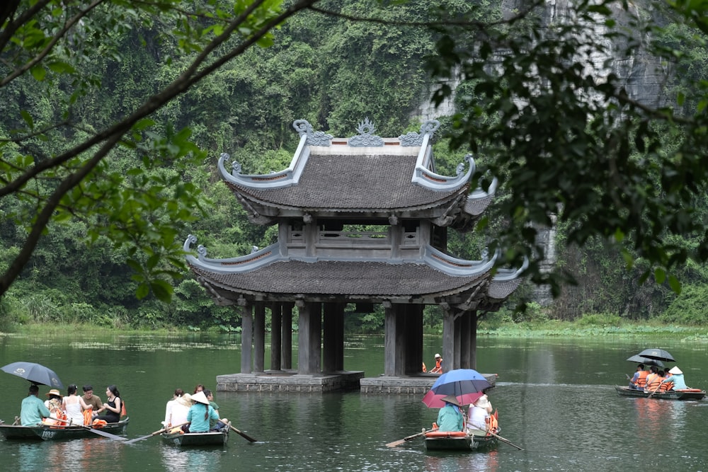 a group of people on small boats in the water