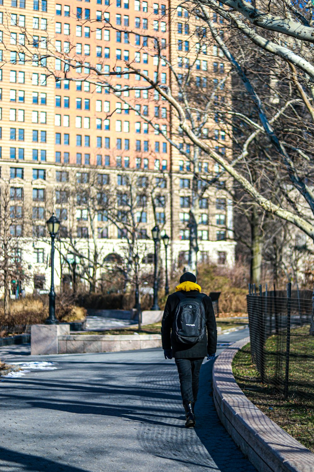 a person walking down a street with a backpack