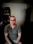 A friendly credit society officer assisting a member with loan paperwork in a cozy office.