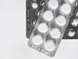 Close-up of Kemicetine branded antibiotic packaging with a clean medical background.