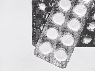 Packaging of transdermal patches with clear labels and modern design on a clean white table.