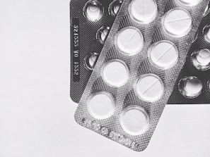 Precision tablets stacked in blister packs showcasing clean packaging design