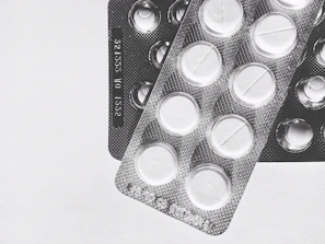 Close-up of Kemicetine branded antibiotic packaging with a clean medical background.
