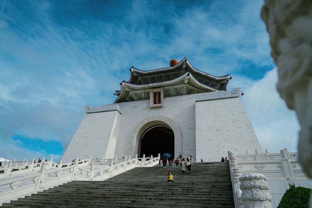 a large white building with stairs leading up to it