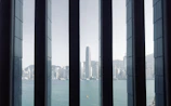Corner office window setup providing panoramic city views with minimal frames