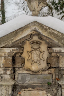 A weathered banner of a noble house, its colors muted but its sigil still proud against a darkened stone wall.