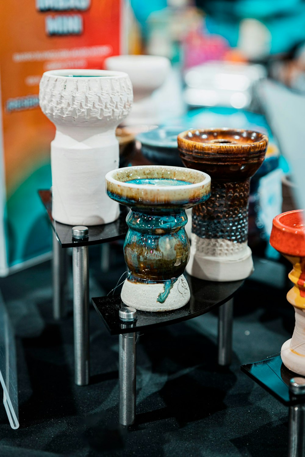 a group of vases sitting on top of a table