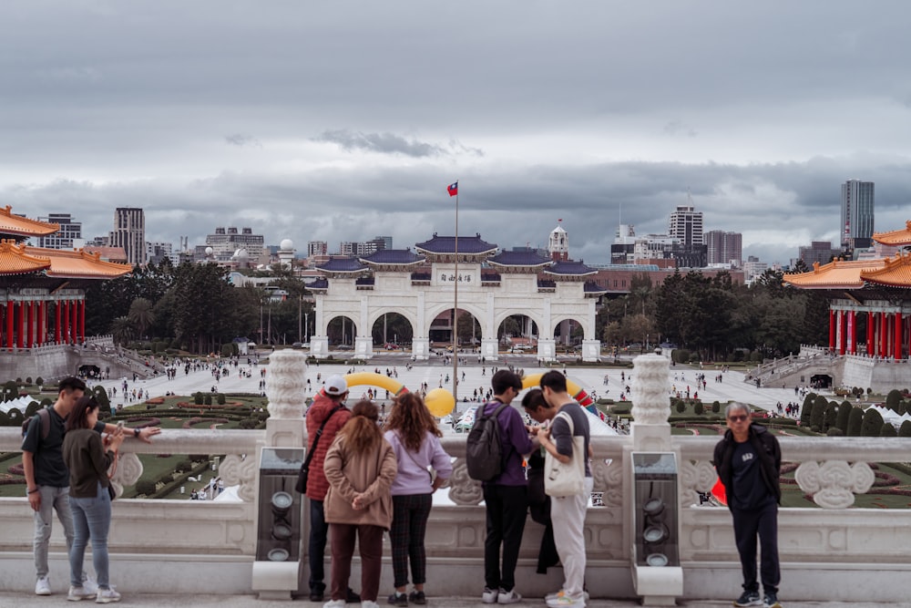 a group of people standing in front of a building