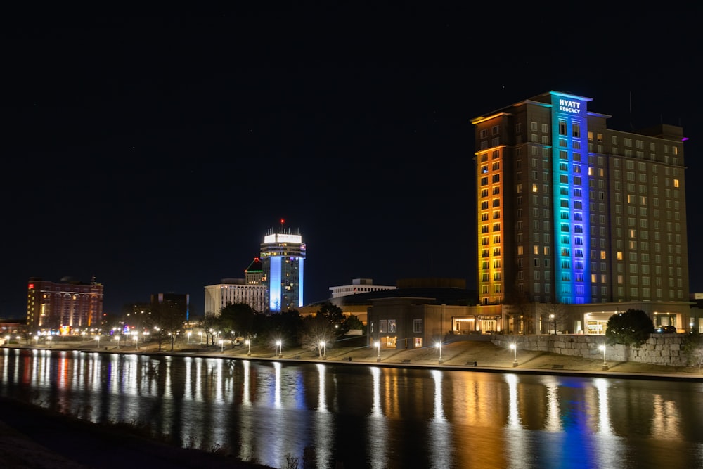 a night view of a city with a river running through it