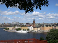 a large body of water with a city in the background