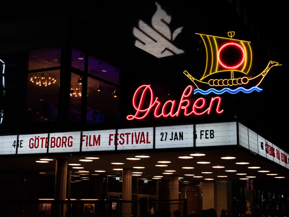 a theater marquee lit up at night