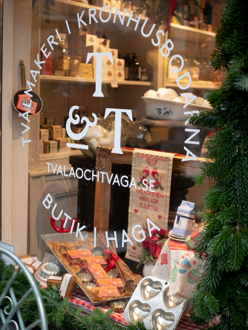 a store window with christmas decorations and gifts in it
