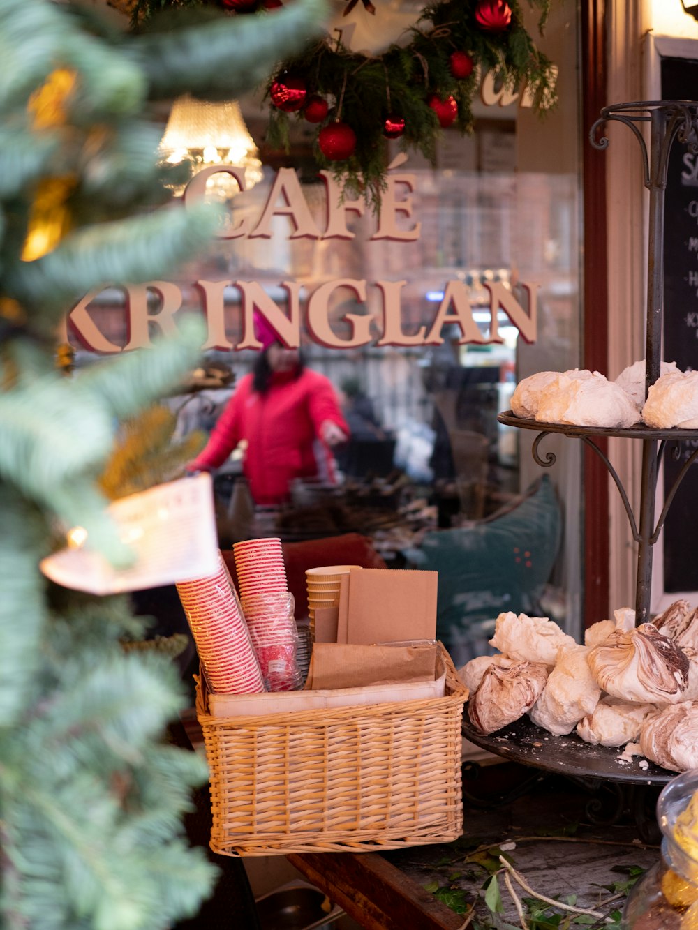 a store front with a display of cakes in a basket