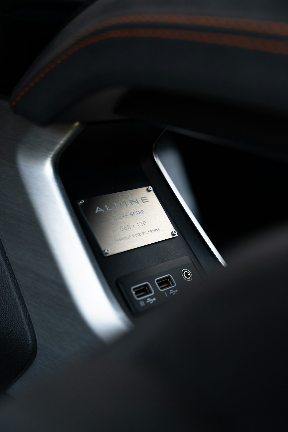 a close up of a cell phone in a car