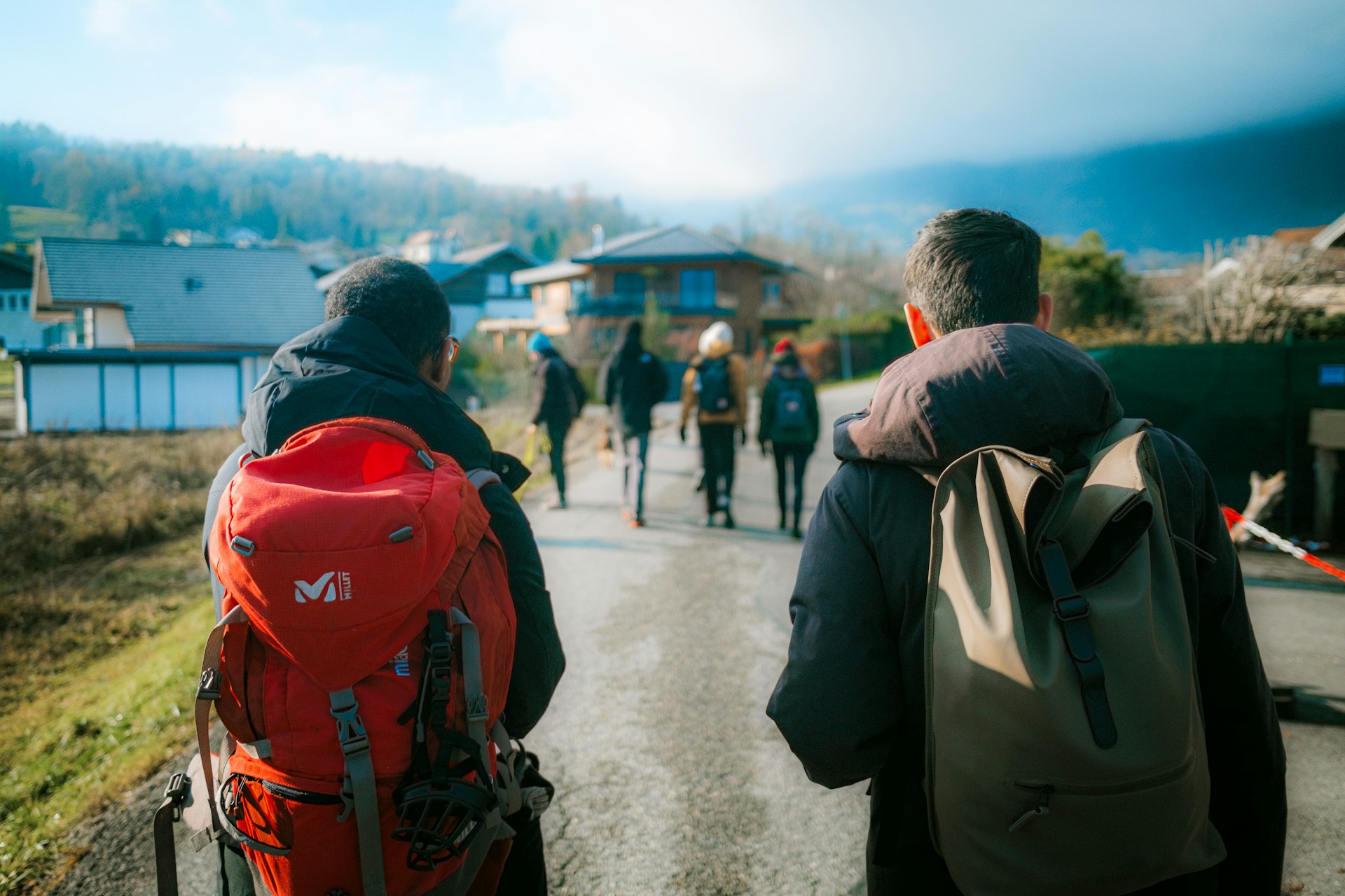 woman wearing yellow long-sleeved dress under white clouds and blue sky during daytime