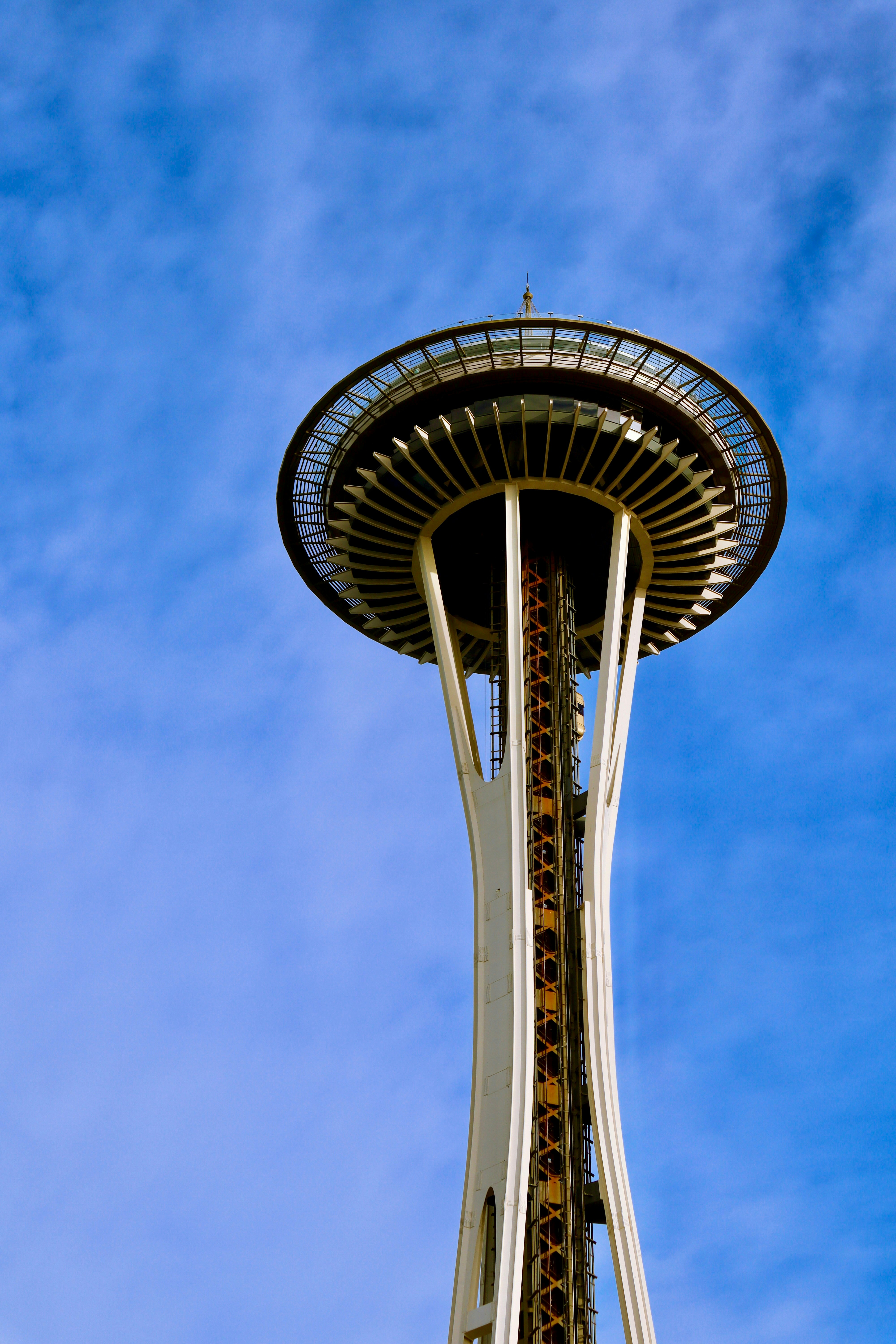 a very tall tower with a clock on it's side