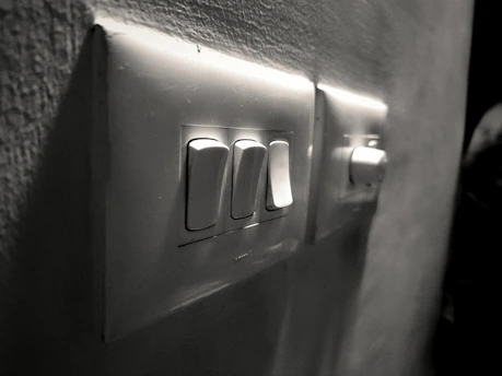Close-up of a smart switch panel with illuminated buttons