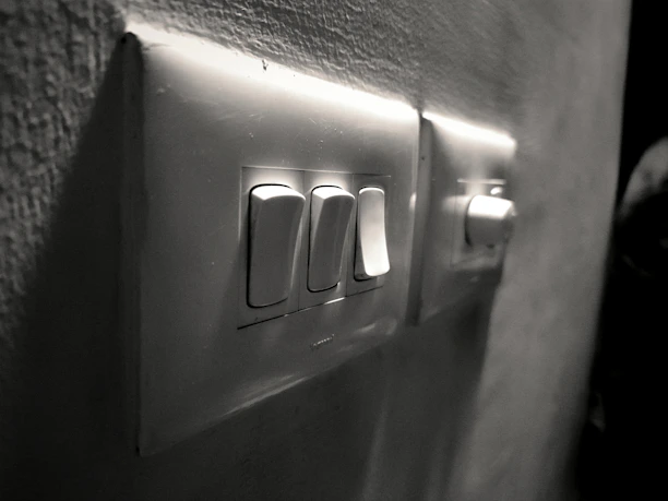 Close-up of sleek electrical switches installed neatly on a modern wall.