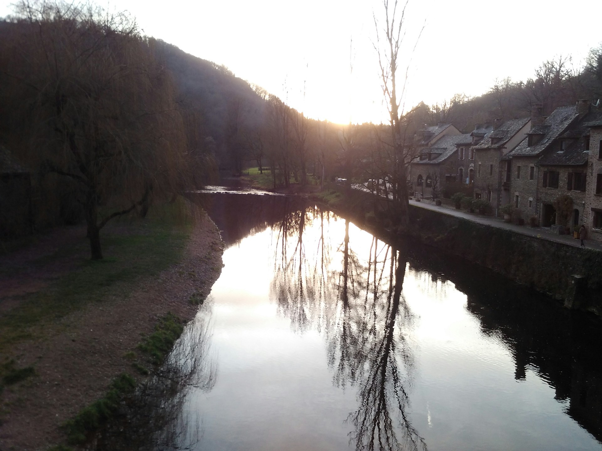 woman wearing yellow long-sleeved dress under white clouds and blue sky during daytime