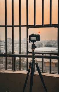 CCTV camera mounted on a residential building in Gorontalo during sunset