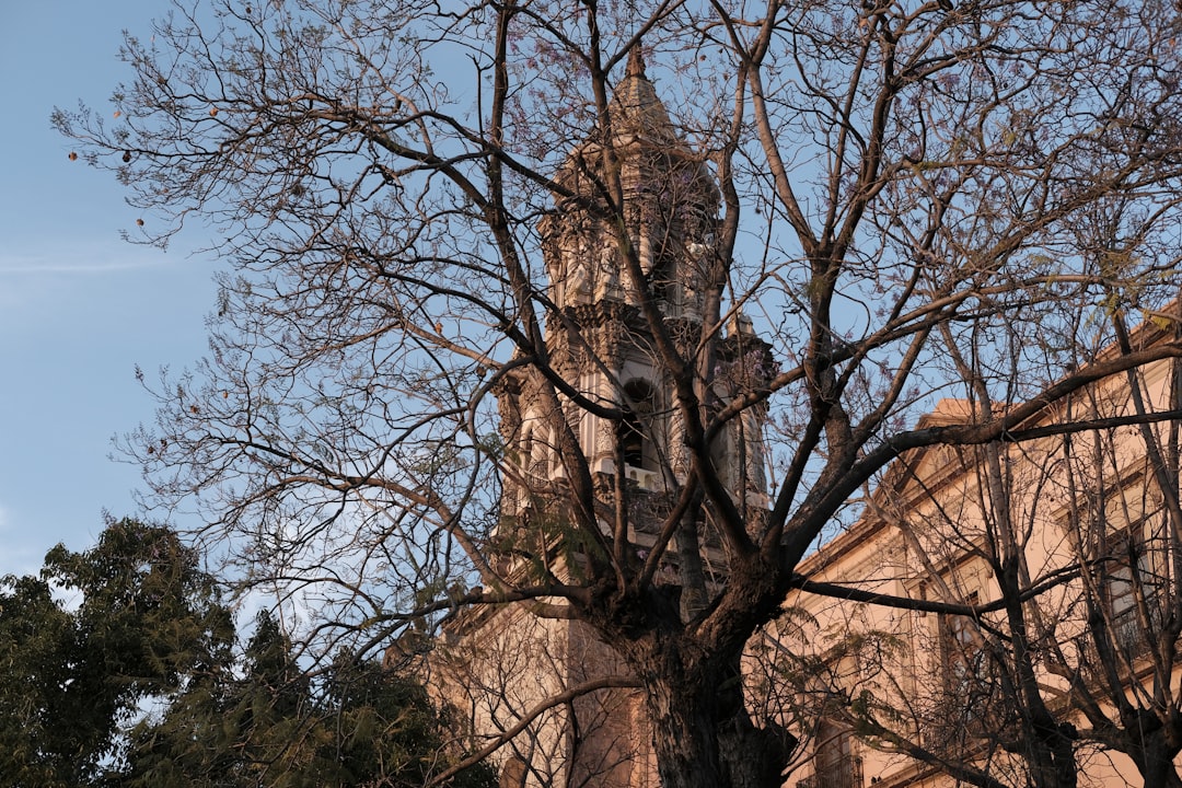 a tall building with a clock on the front of it,