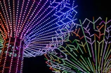 Elegant LED dance show with vibrant lights creating dynamic patterns.