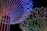 A vibrant display of multicolored LED lights arranged in radiating patterns forming intricate designs against a black background. The lights transition through a spectrum of colors including red, blue, green, and purple, creating a mesmerizing visual effect.