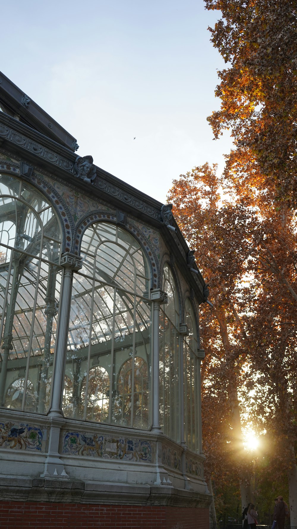 the sun is shining through the glass roof of a building