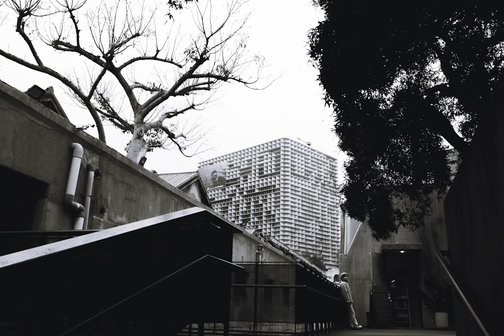 a black and white photo of a building and stairs