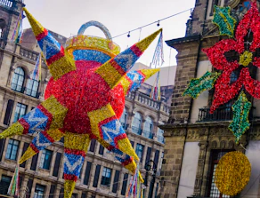 Vibrant custom piñata hanging against a bright festive backdrop.