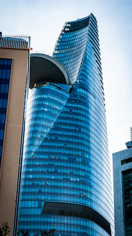 a very tall building with a curved roof