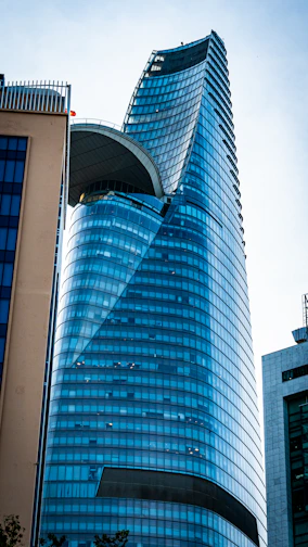 a very tall building with a curved roof
