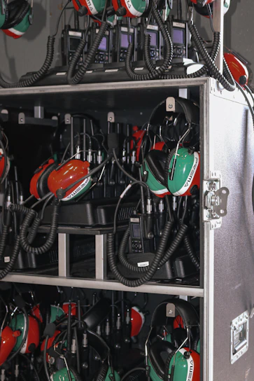 A professional team setting up Hytera radio communication devices in an urban Jakarta office.