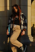 Outdoor shot of a layered outfit combining comfort and style in natural sunlight.