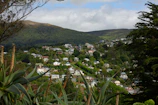 A panoramic view of Bel Air's rolling hills and upscale residences under a clear afternoon sky.