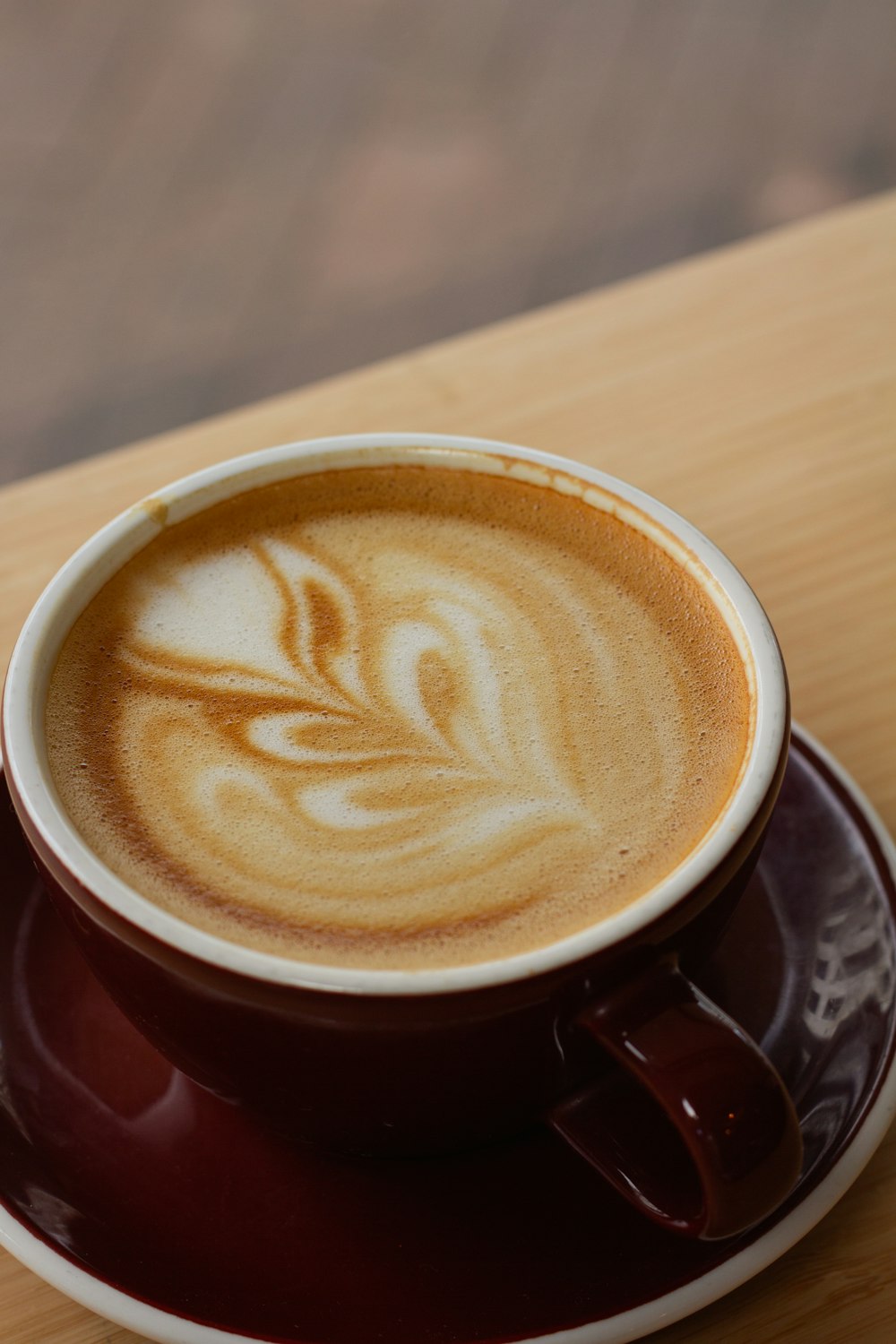 a cup of cappuccino on a saucer