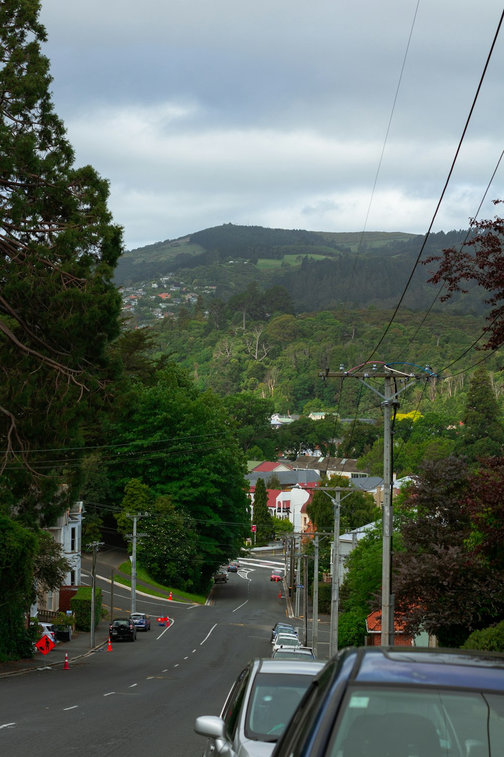 a street with cars parked on the side of it