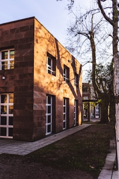 Completed brick facade of a modern São Paulo building at sunset.
