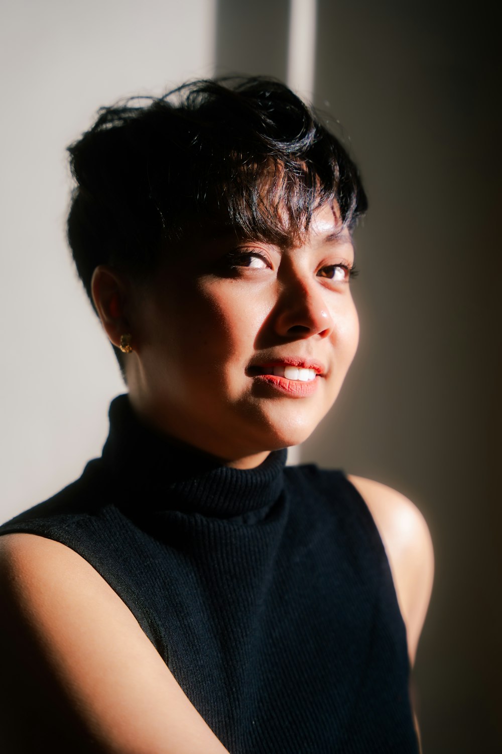 a close up of a person wearing a black shirt