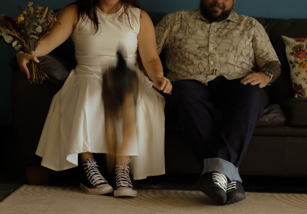 a man and a woman sitting on a couch