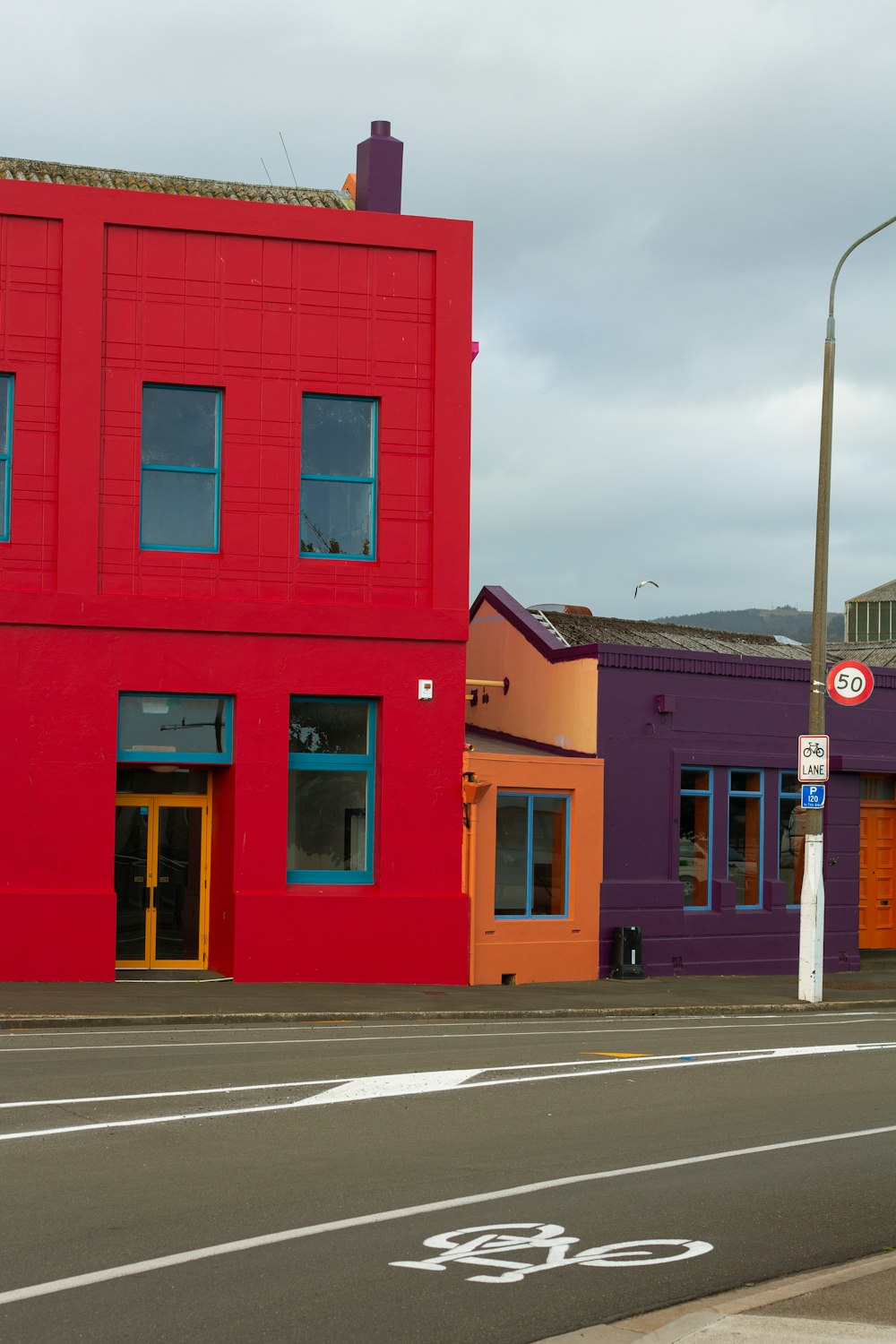 a red building on the corner of a street