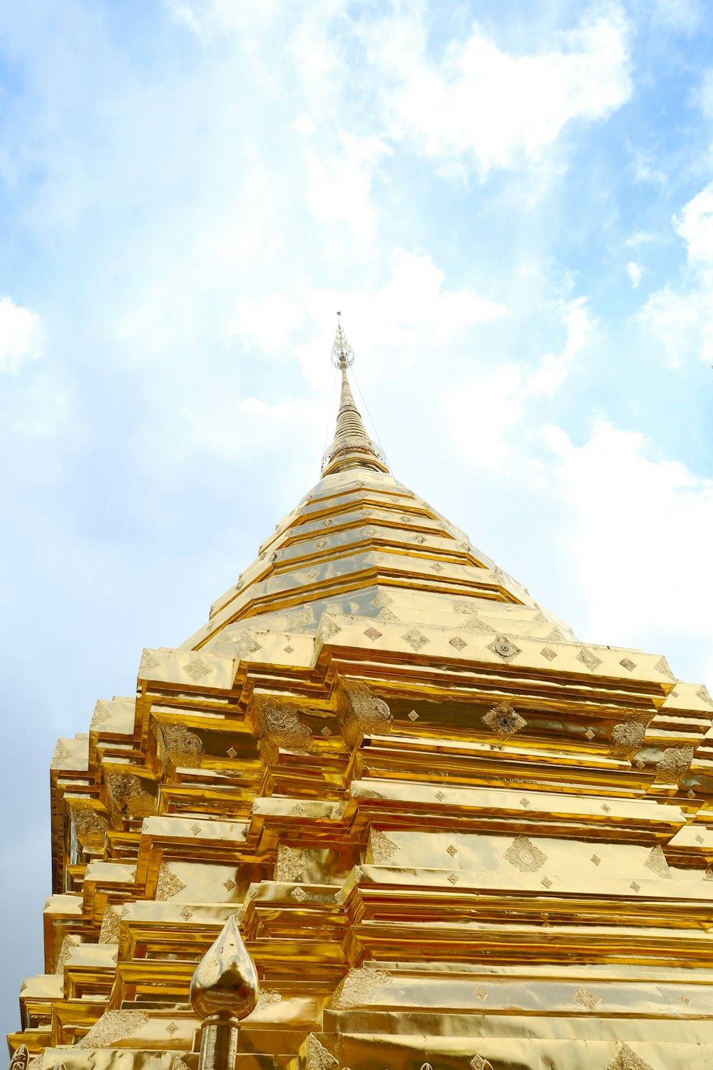 a large golden building with a sky background