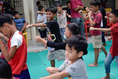 a group of young children playing a game of frisbee