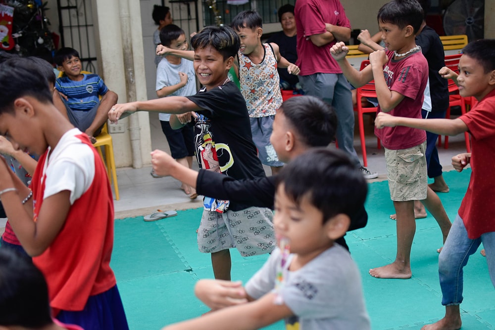 a group of young children playing a game of frisbee