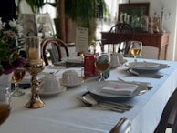 Elegant table setting with a multi-course meal ready to be served for a private dinner.