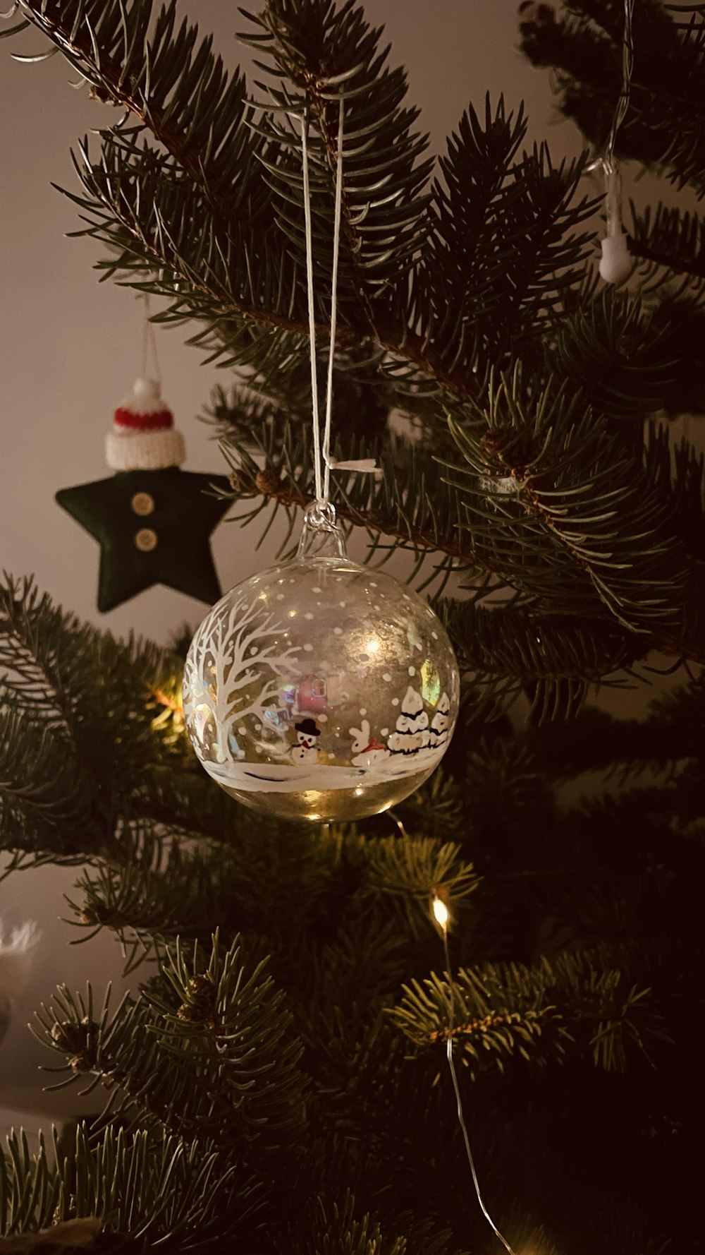 a christmas ornament hanging from a christmas tree